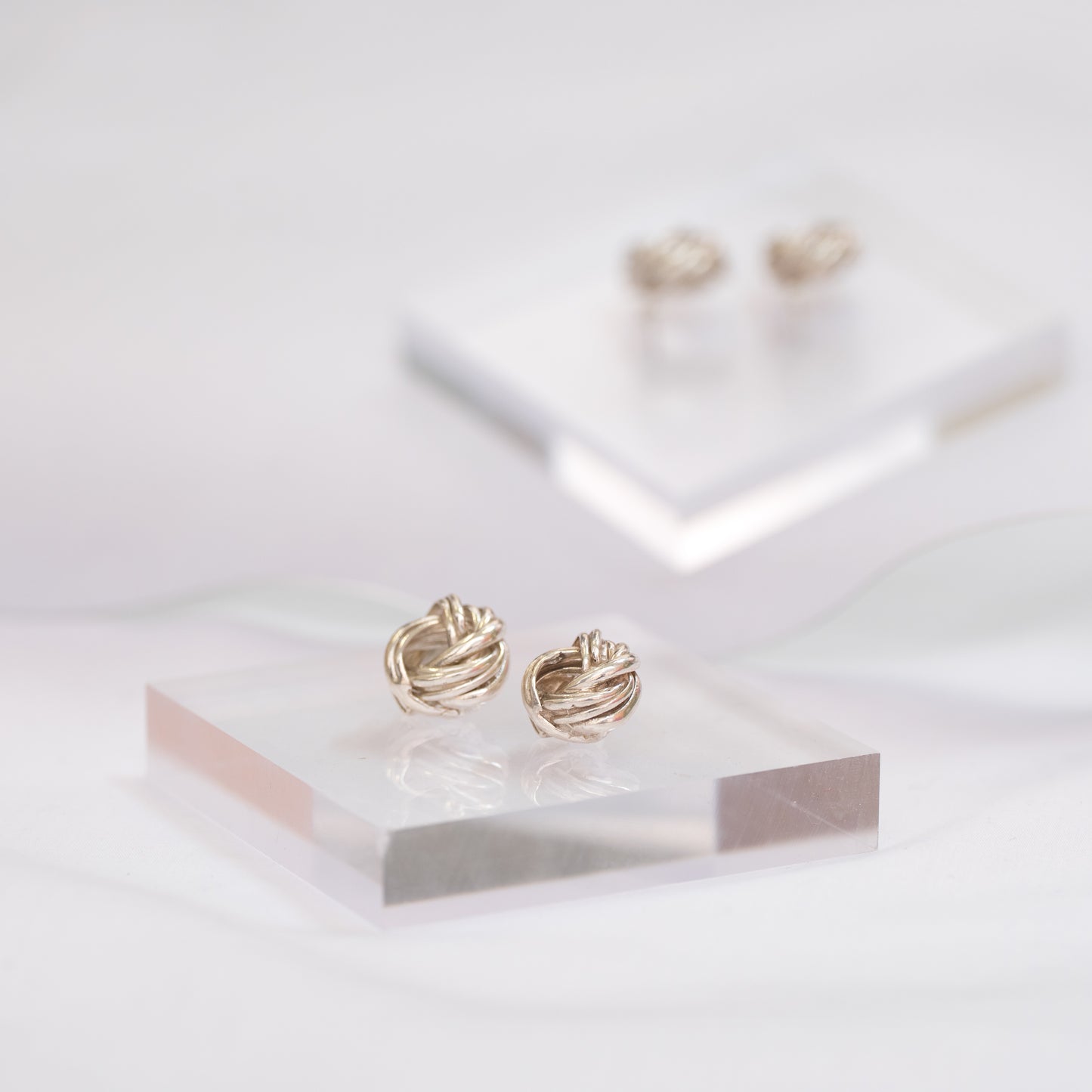 Silver embrace earrings